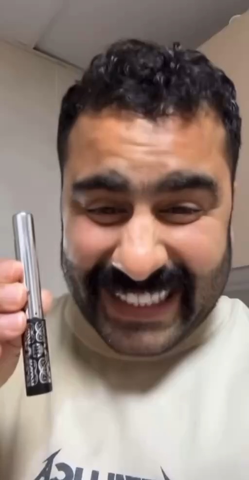 Son pranks his father while he is sleeping