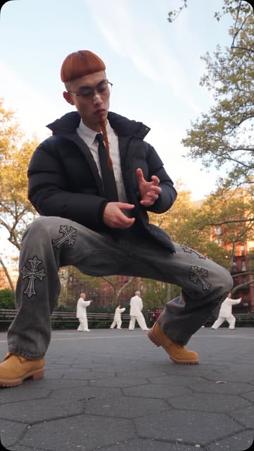 Randomly caught the Chinese grandpas doing tai-chi in the background