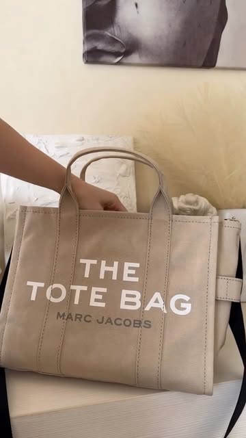 Adore this Marc Jacobs tote bag from @Farfetch because it literally holds my entire life while making every outfit lo...