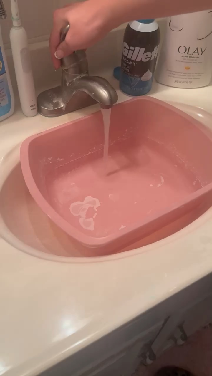 Filling up wash basin for bed bath