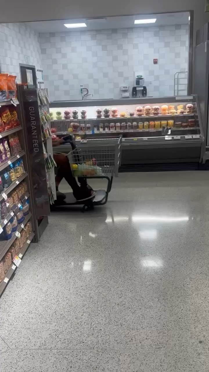 Sister joy riding in Publix