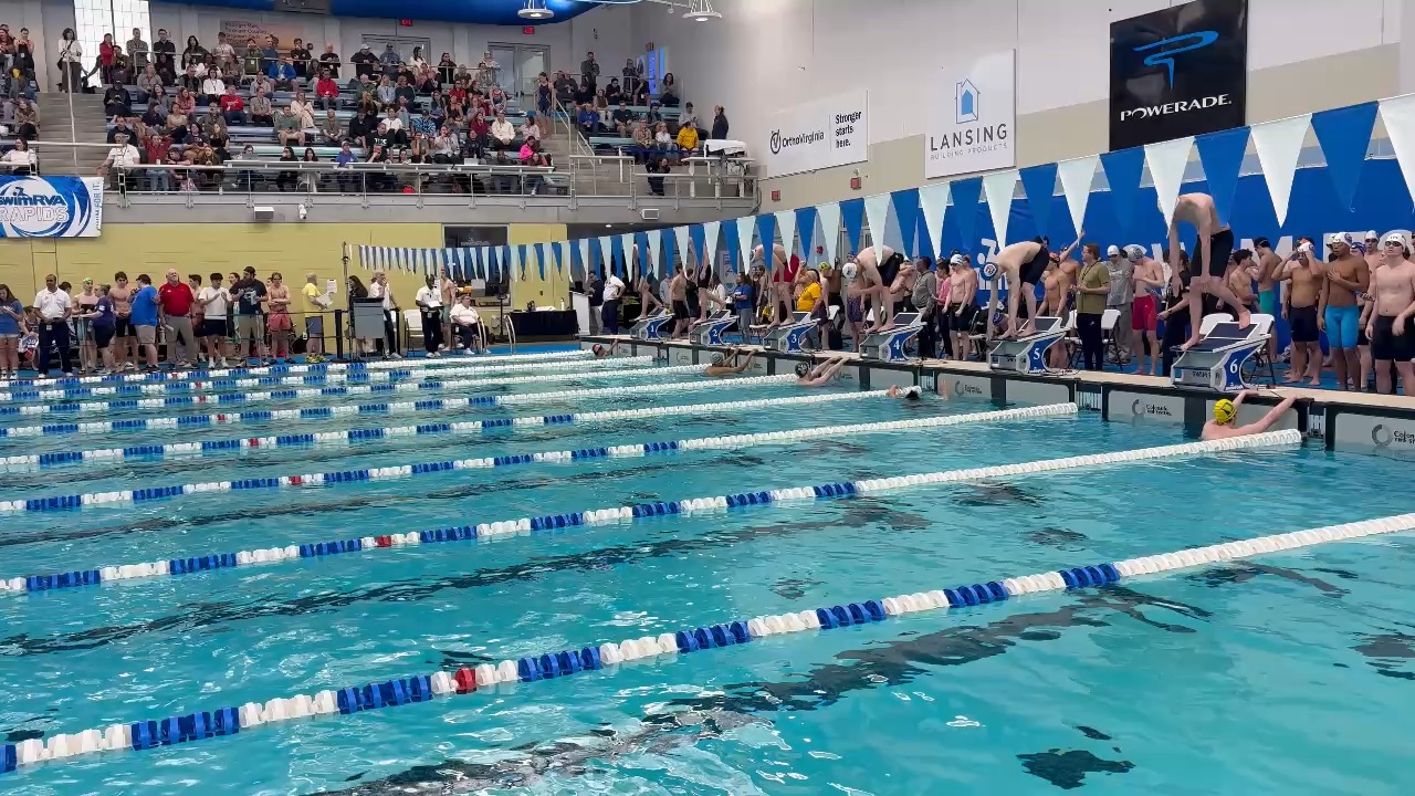 50 Freestyle PB, white cap black suit.