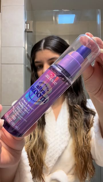 The Aussie Ultra Smooth Glossing Shield is my finishing step for smooth, shiny looking hair .It also provides heat pr...